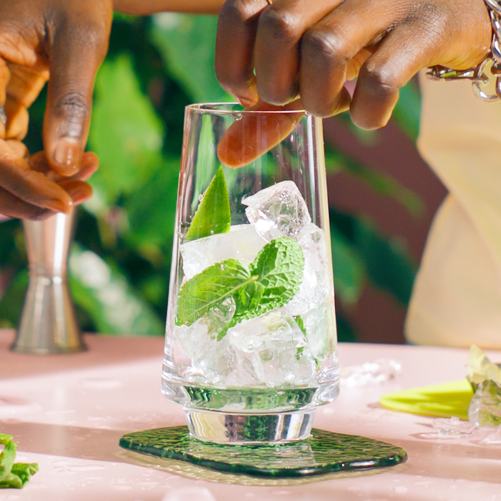 Malibu Mojito on a table in a tropical setting being made - step 1