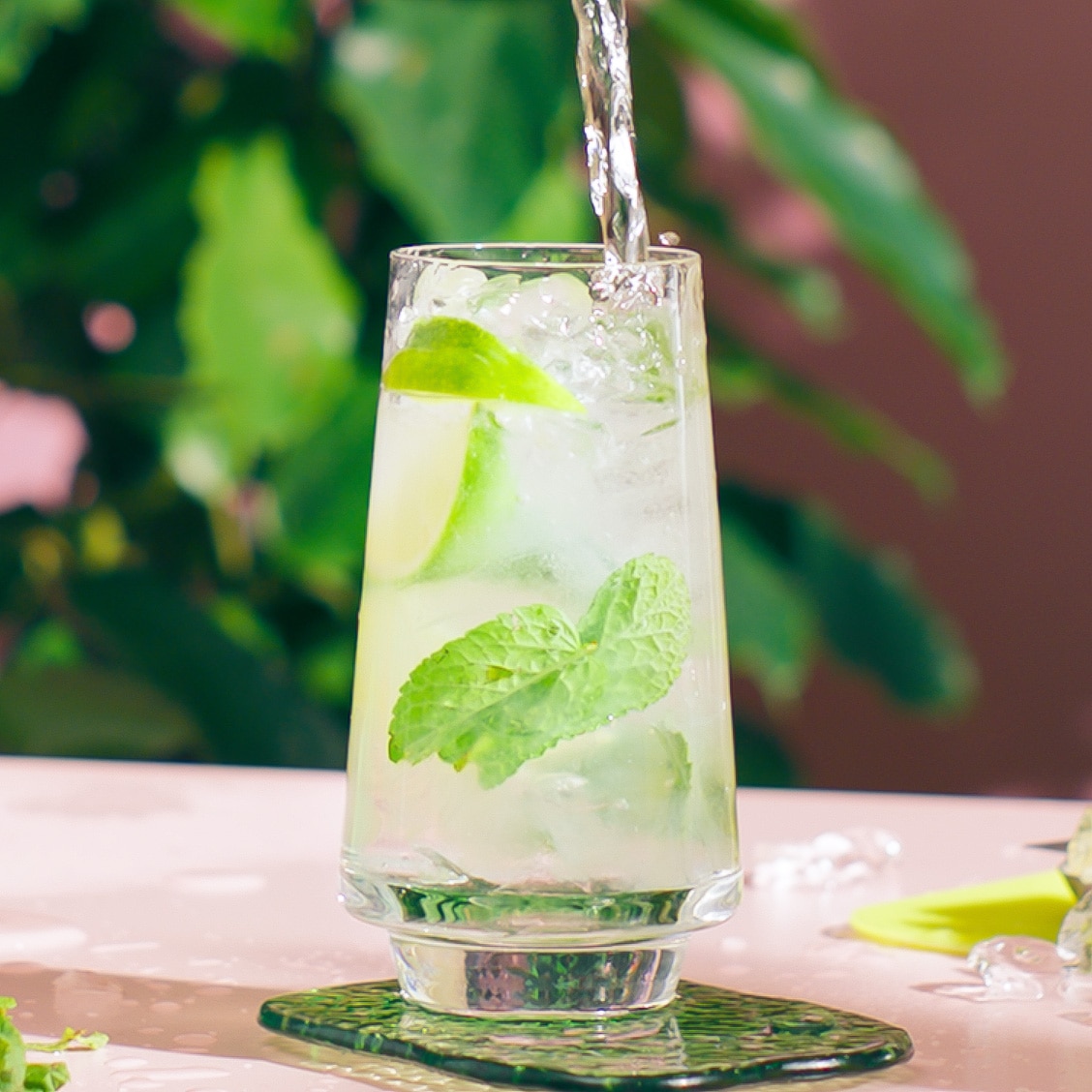 Malibu Mojito on a table in a tropical setting being made - step 3