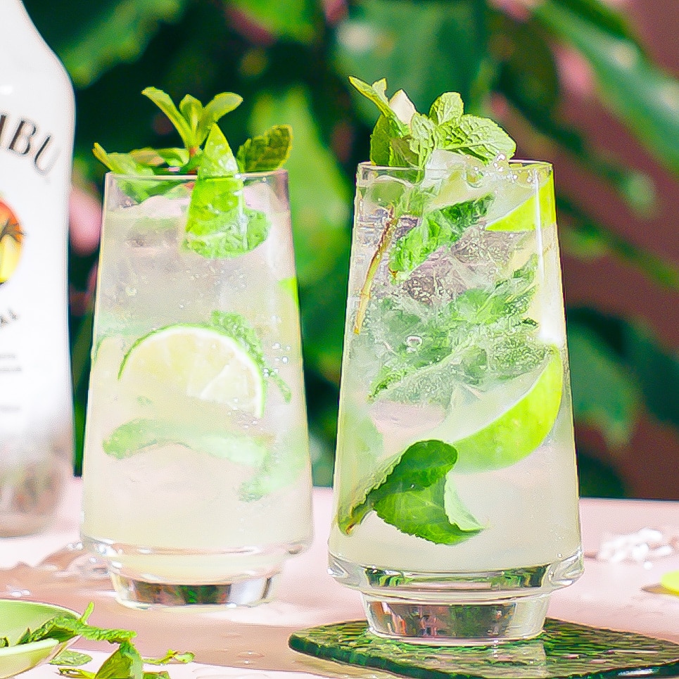 Two Malibu Mojitos on a table in a tropical setting - step 6